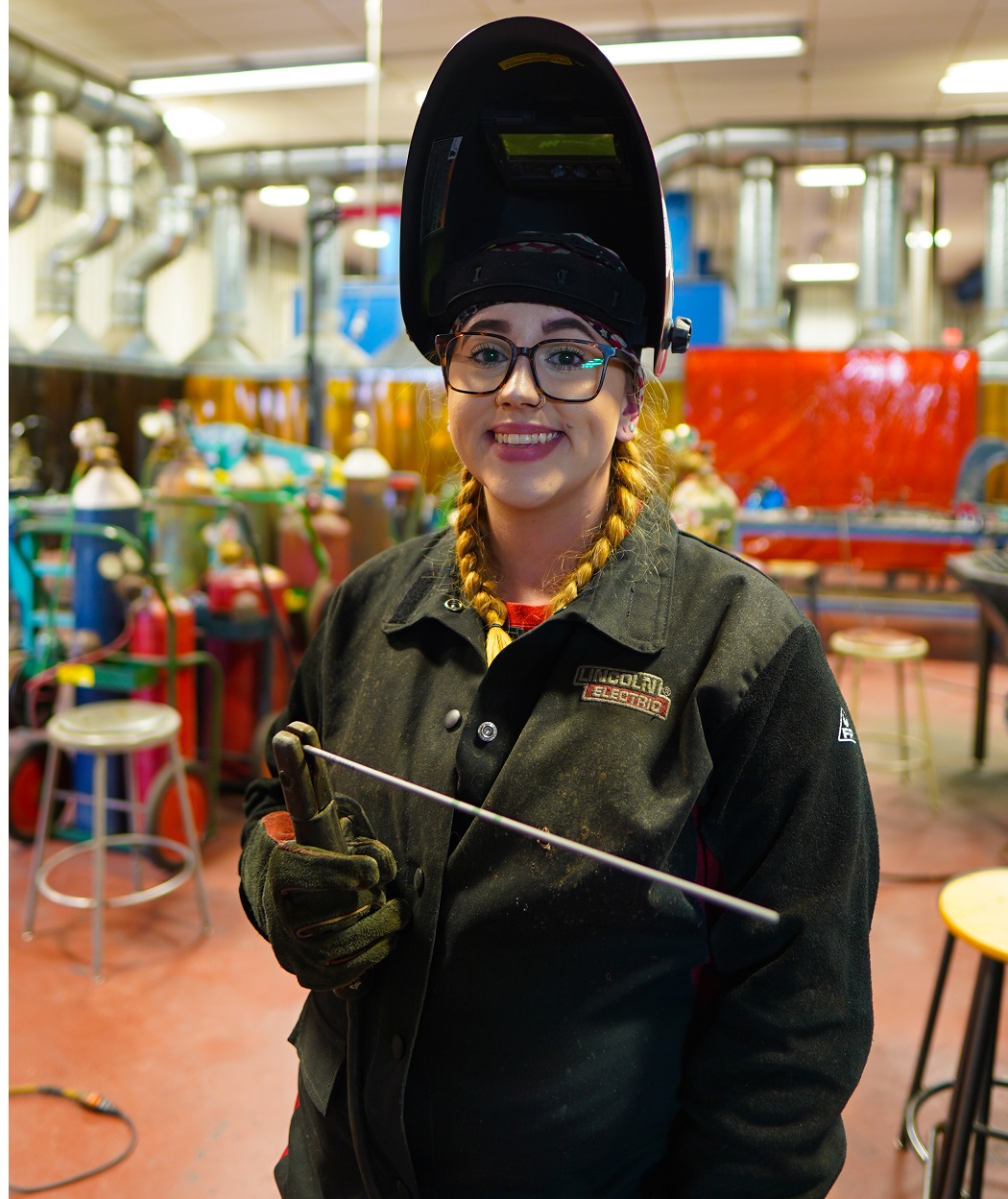 female welder smiling